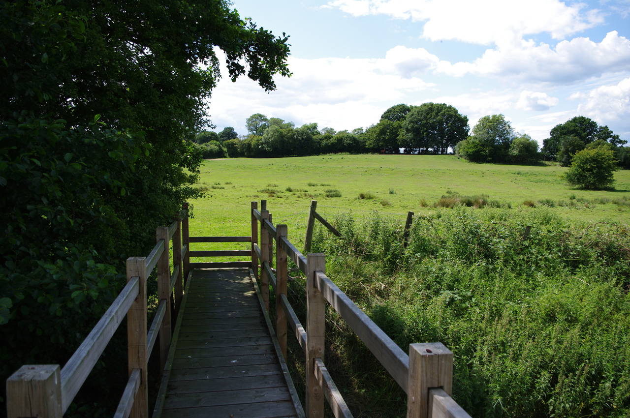 Footbridge between fields